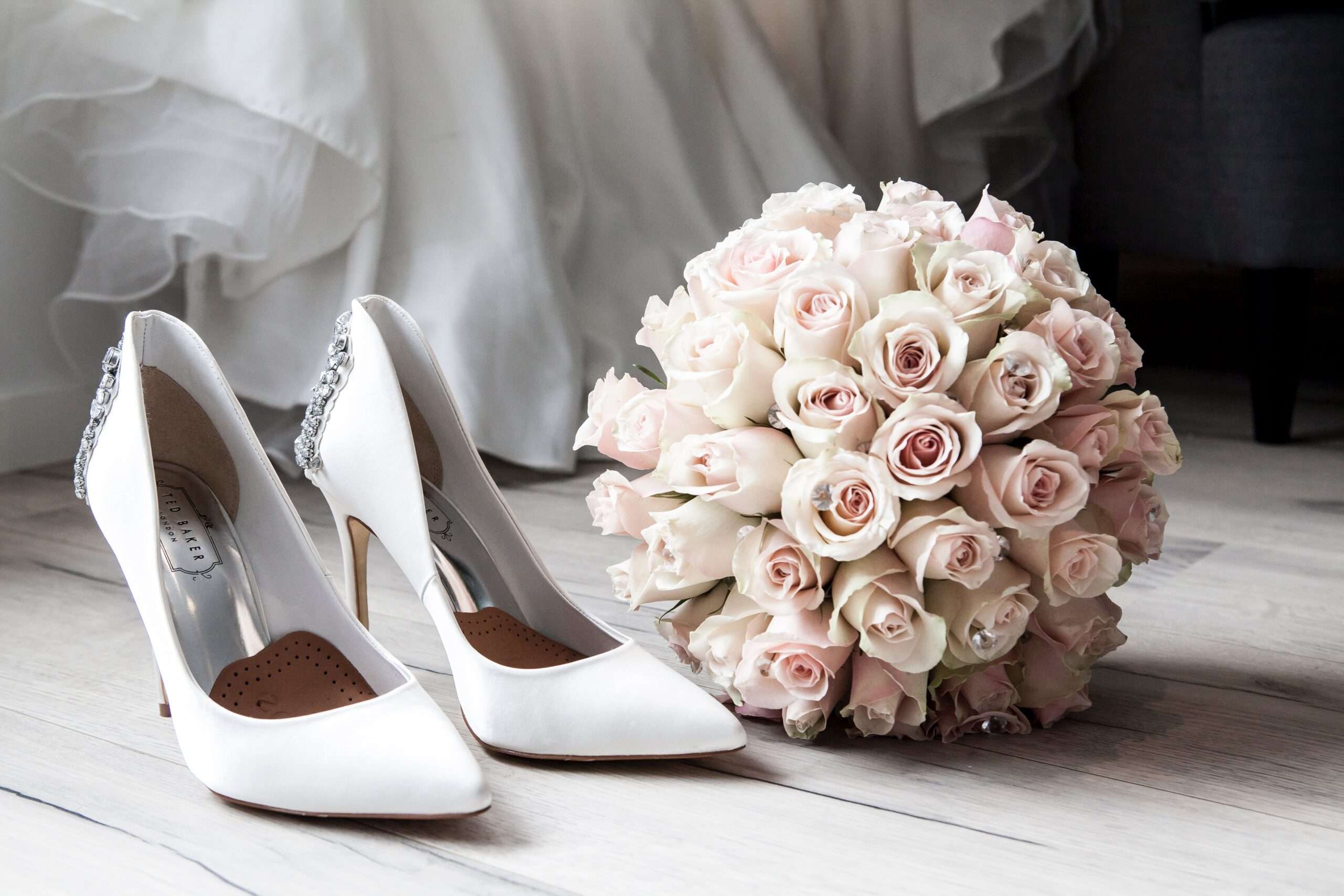 White shoes, wedding dress, and flowers